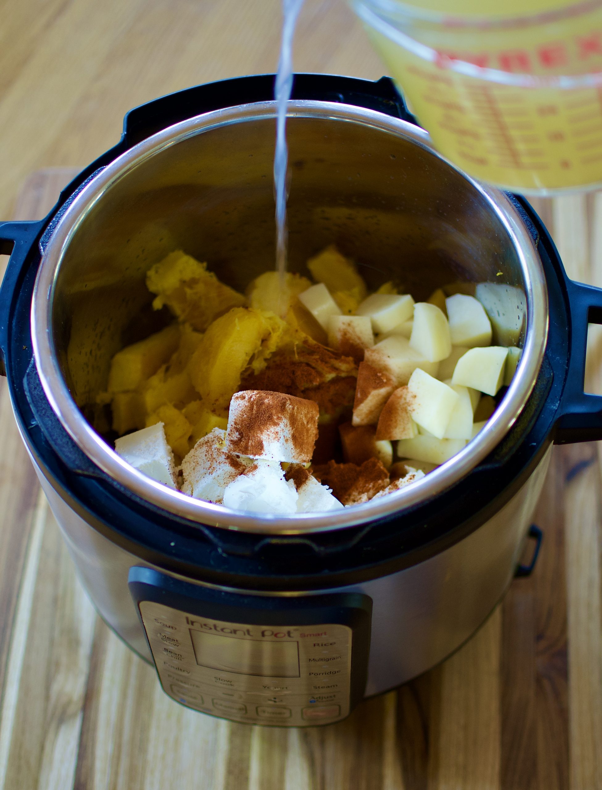 Chicken Stock pouring into an Instant Pot