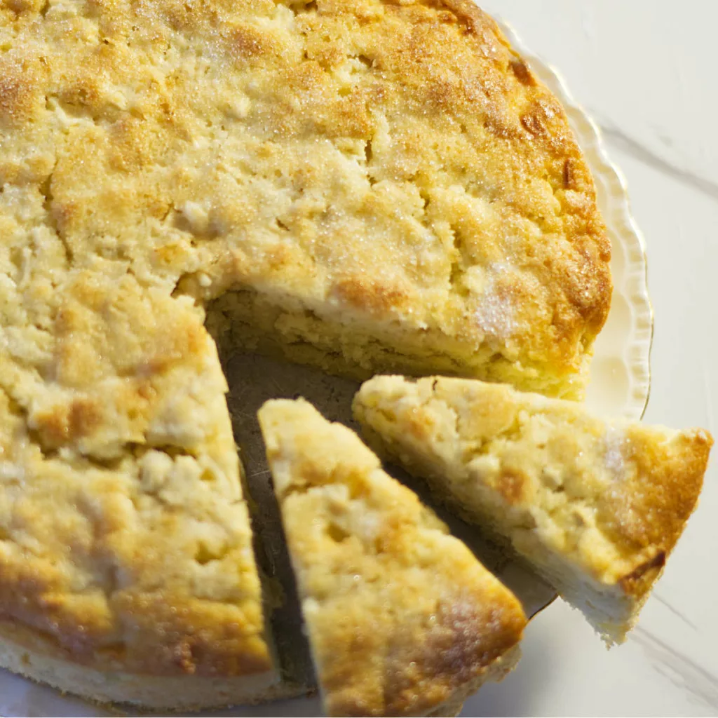 Whole Irish Apple Cake with two slices cut from it.