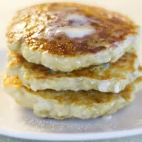 Three Irish Pancakes served with butter and sugar.