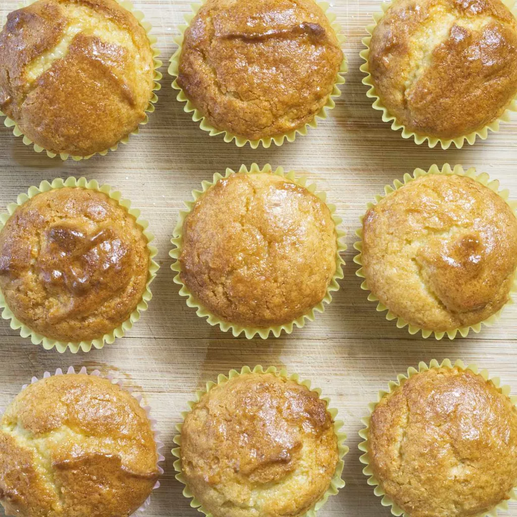 A board containing nine Lemon Drizzle Muffins.