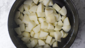 Potatoes in a pot, boiled and drained from water.