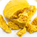 Yellowman honeycomb pieces showing surface and internal texture.