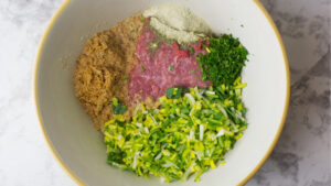 All the ingredients in a bowl before mixing to form Vegetable Roll.