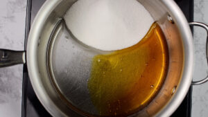 Sugar and golden syrup in a pot.
