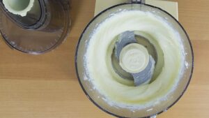 Creamed butter and sugar in a food processor.