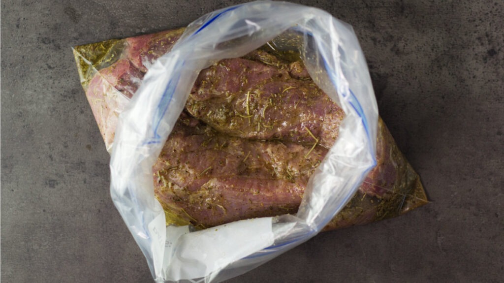 Ziplock bag containing all ingredients including the two tenderloins.