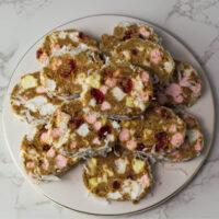 White round plate with slices of Fifteens on it.