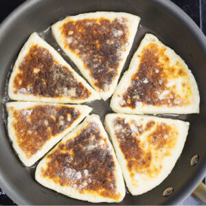 Pan containing fried Potato Farls.